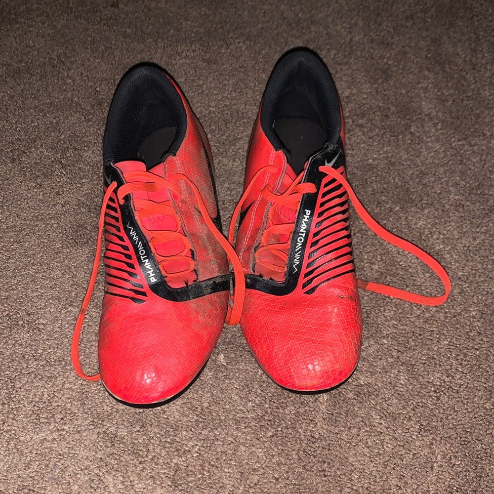 Red phantom nike have mud will before they are shipped off.